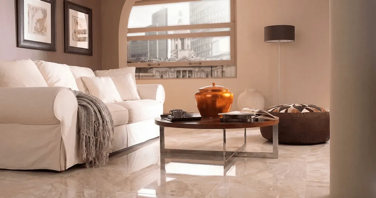 Modern living room with professionally installed marble flooring, a beige sofa, coffee table in Oakland, CA