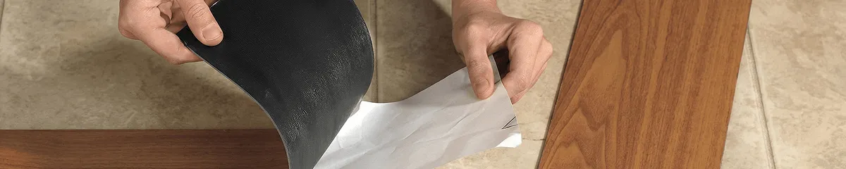 A professional installing vinyl flooring in Oakland, CA